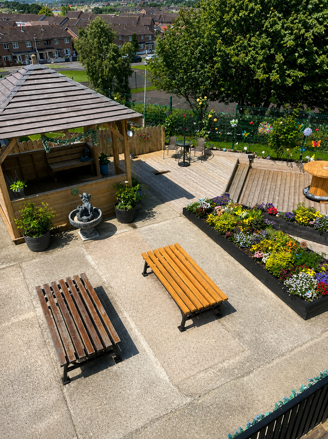 Overview of the community garden in Leafair with raised beds, seating and planting areas